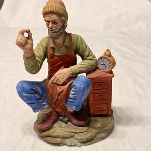Vintage Taiwan ceramic painted figurine of Man sitting on stone next to …